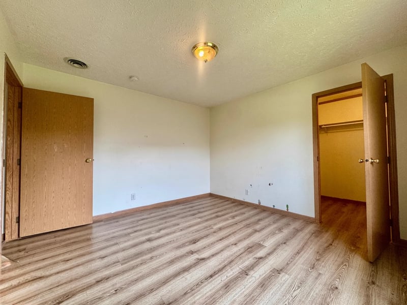 Additional bedroom with laminate flooring
