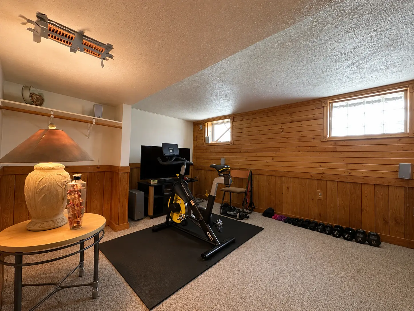 Second view of the finished basement rec room at 3718 Revere Drive showing the full flex space