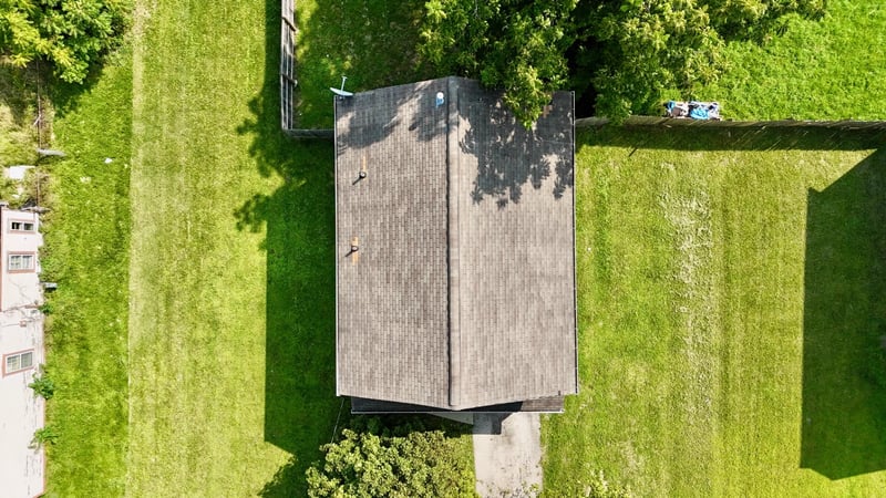 Overhead aerial view of the home and surrounding yard