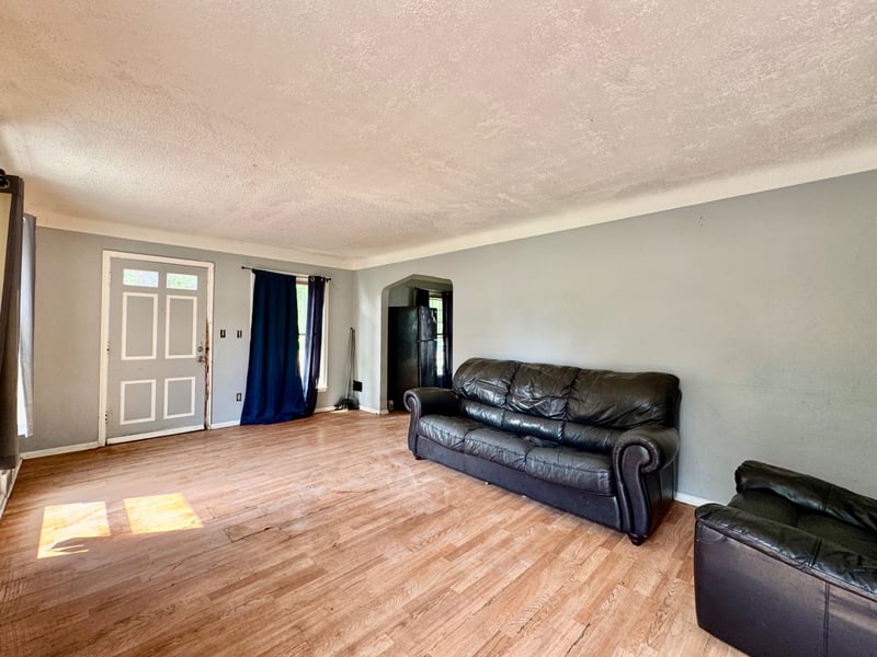 Living room at 510 Richards Road with hardwood floors and front entry