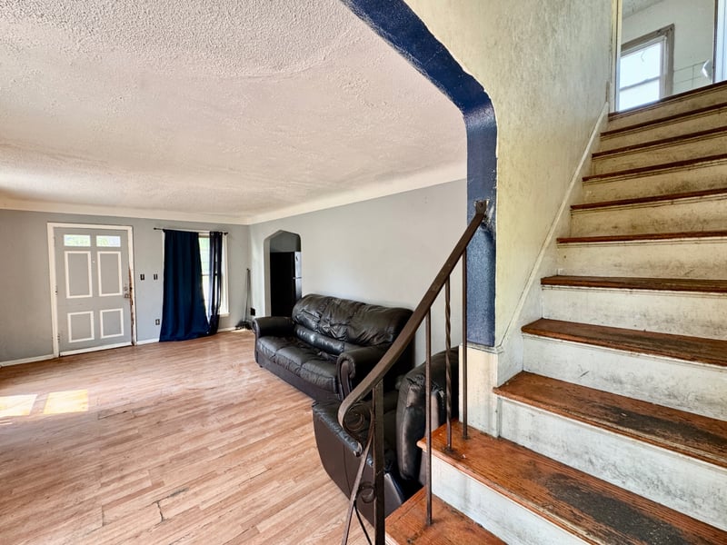 Living area and staircase at 510 Richards Road