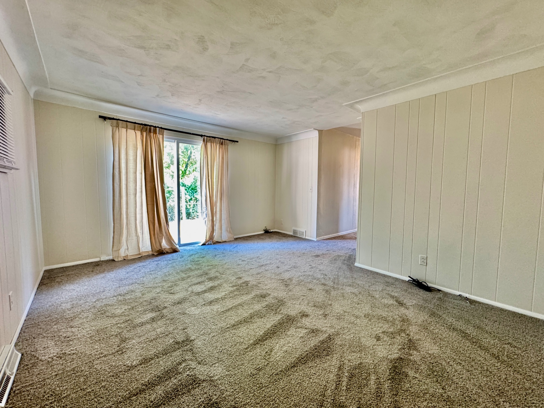Large rear family room with sliding glass door
