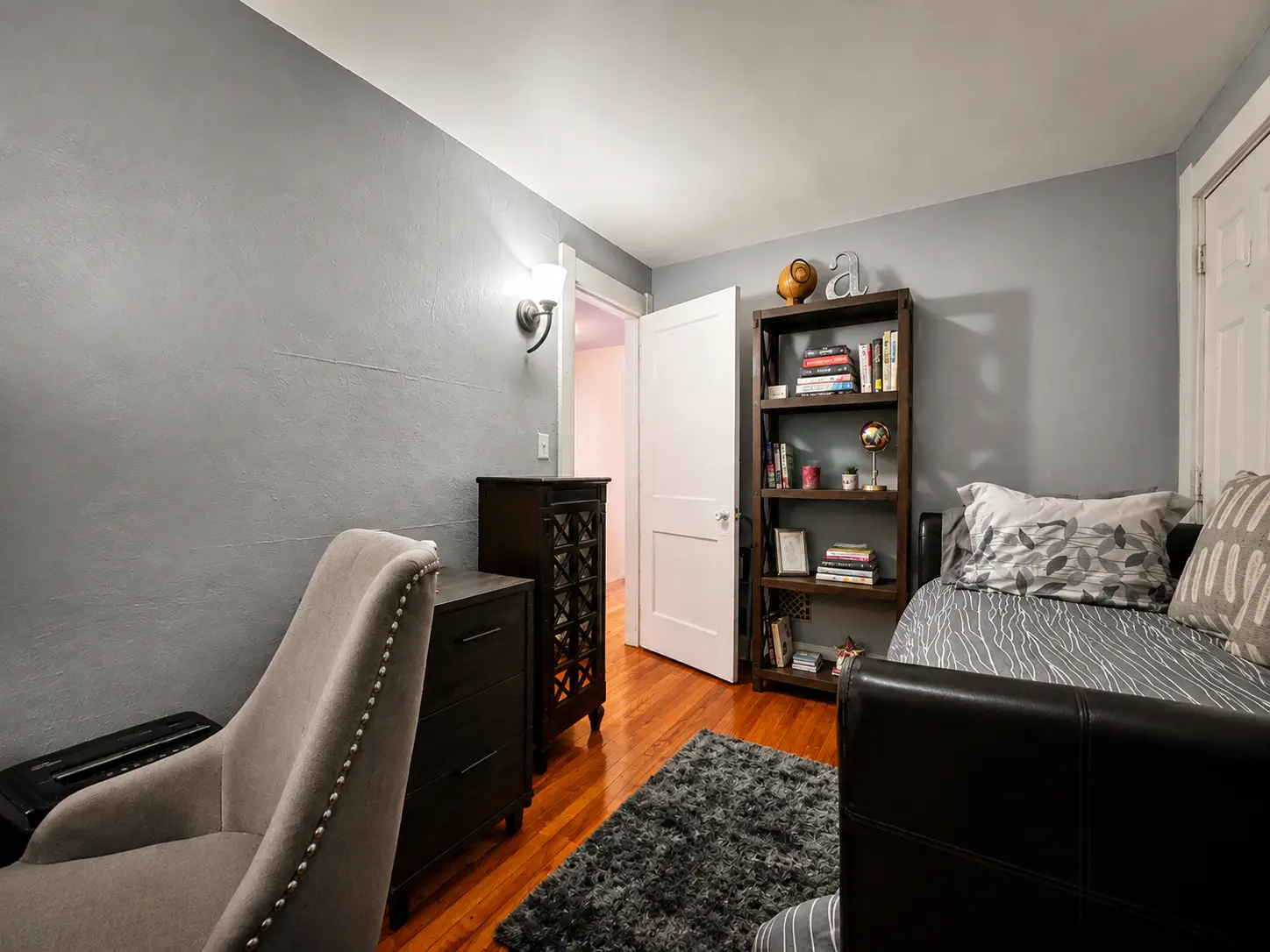 Second view of the bedroom at 3718 Revere Drive showing the closet and hardwood floors