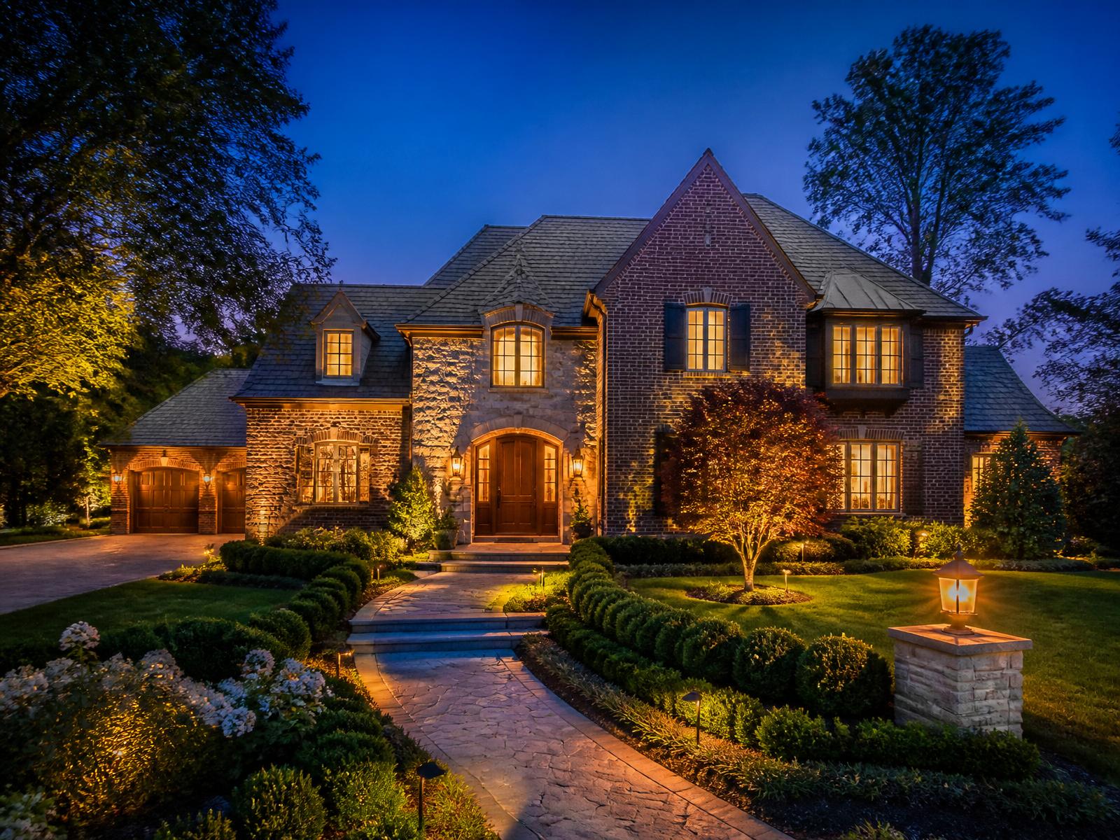 Ottawa Hills brick and stone estate at twilight